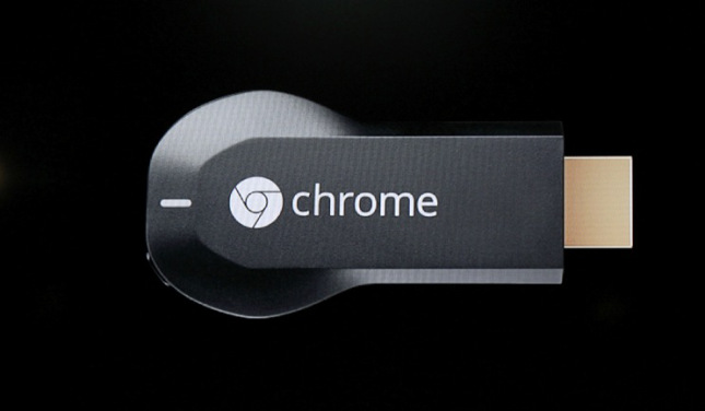 The new Google Chromecast dongle is pictured on an electronic screen as it is announced during a Google event at Dogpatch Studio in San Francisco
