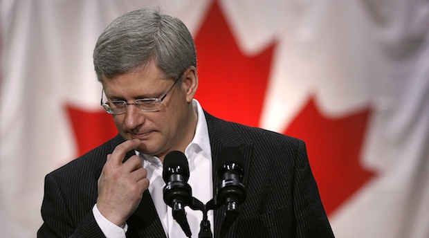 Conservative leader and Canada's Prime Minister Harper pauses while speaking during a campaign stop at an automobile parts factory in Brampton